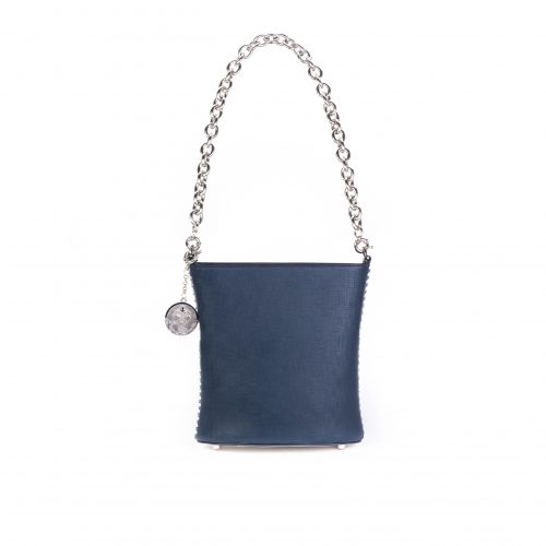 A blue purse with silver chain strap and a charm.