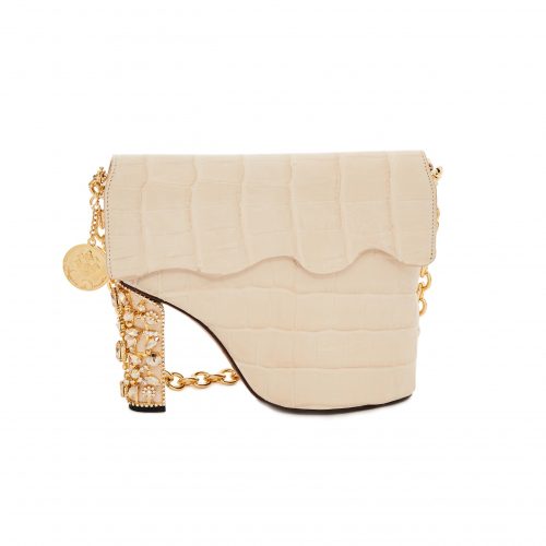 A white purse with gold chain and heel.