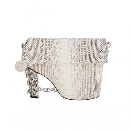 A white purse with a chain handle and a heel.