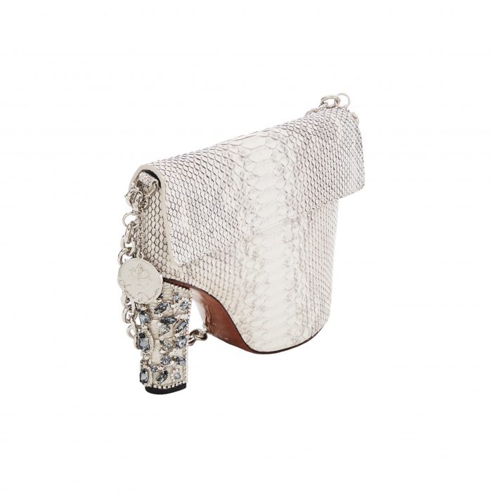 A white purse with a chain handle and a heel.