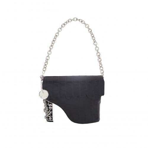 A black purse with a chain hanging off of it.