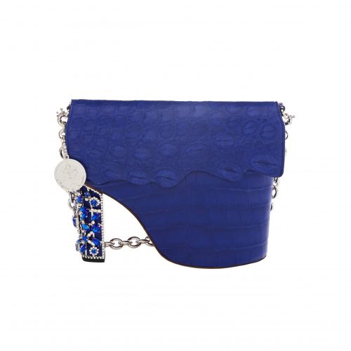 A blue purse with a chain strap and a coin on the bottom.