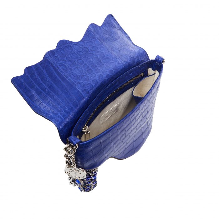 A blue purse with a chain strap and a silver chain.