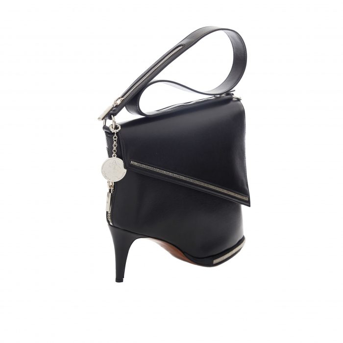 A black bag with a heel and a strap