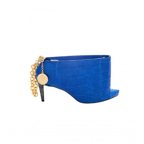 A blue shoe with gold chain on it.