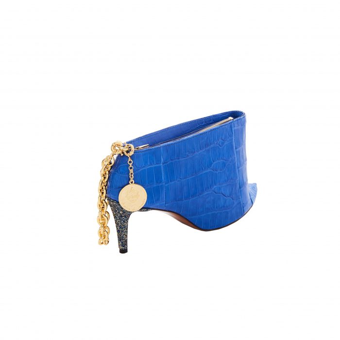 A blue purse with a key on it