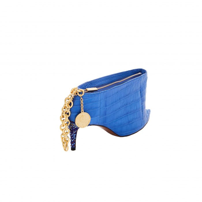A blue purse with gold chain and a coin holder.