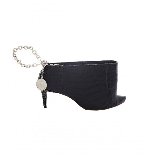 A black purse with a chain and a heel.