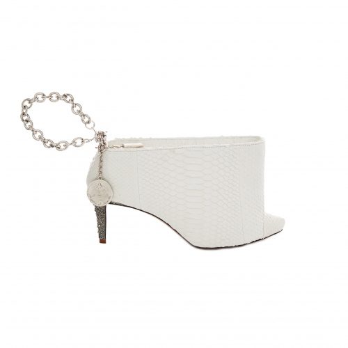 A white purse with a chain and heel.
