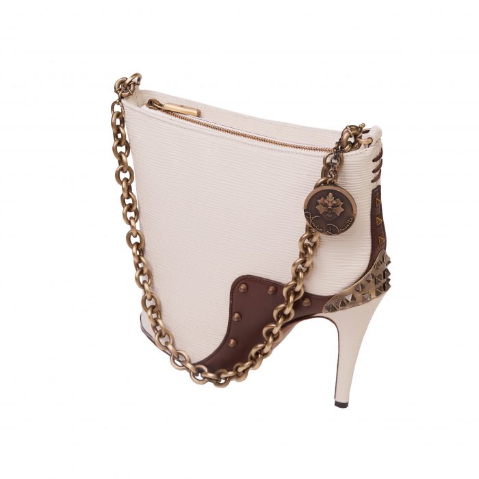 A white purse with a brown heel and chain strap.