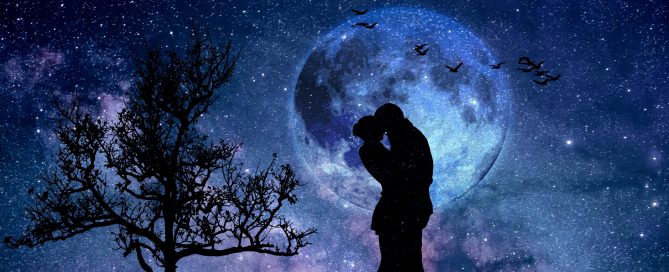 A man and woman kissing in front of the moon.